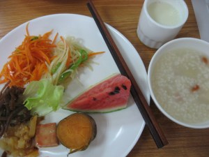sauteed carrot, potato slivers, watermelon, sweet potato, fermented chili tofu, 2 mystery pickles. Congee with gojee berries. Warm bean milk.