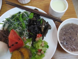 watermelon, pickled something, rice noodle & greens sesame garlic stuff, garlic mushrooms, boiled peanuts and celery, sweet potato, bean bun