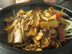 "braised assorted delicacies". = rehydrated mushrooms
